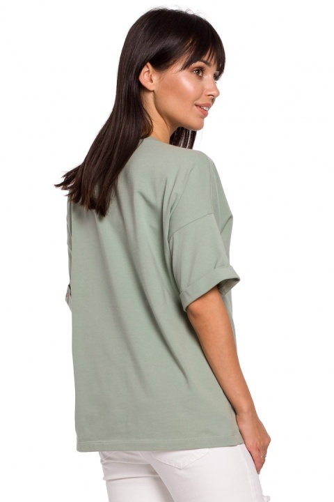 Bluzka damska oversize z głębokim dekoltem krótki rękaw pistacjowa B147 Bluzka damska oversize z głębokim dekoltem krótki rękaw pistacjowa B147