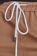 Spodnie damskie dresowe z obniżonym krokiem wiązane beżowe M217
