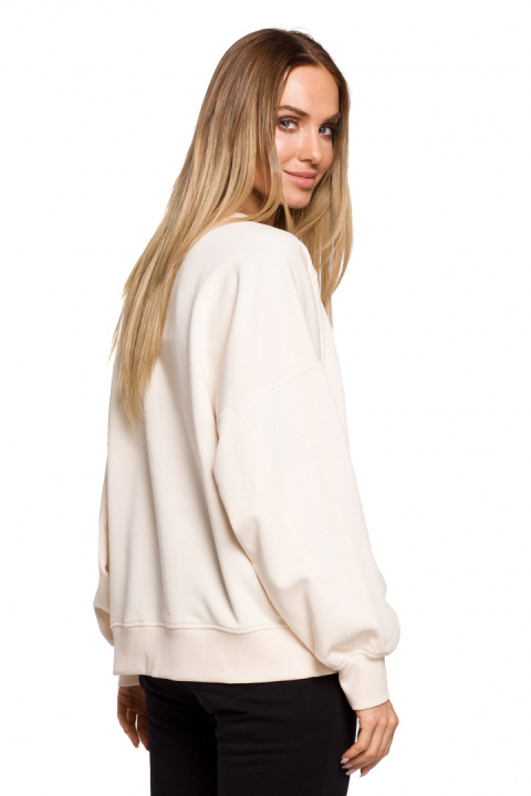 Bluza damska dzianinowa oversize dresowa z nadrukiem waniliowa me613 Bluza damska dzianinowa oversize dresowa z nadrukiem waniliowa me613