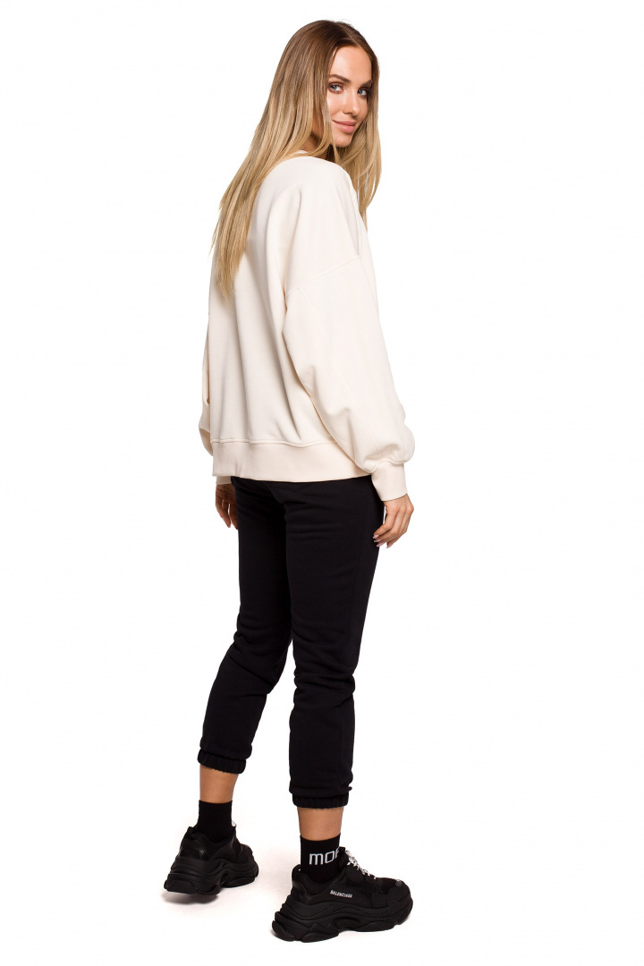 Bluza damska dzianinowa oversize dresowa z nadrukiem waniliowa me613 Bluza damska dzianinowa oversize dresowa z nadrukiem waniliowa me613