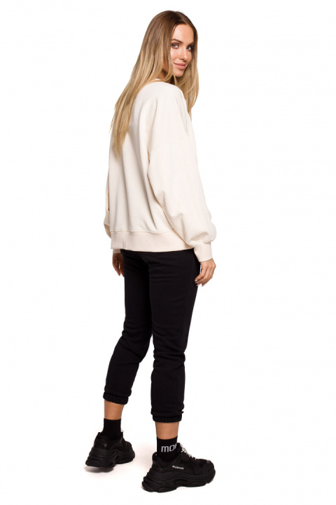 Bluza damska dzianinowa oversize dresowa z nadrukiem waniliowa me613 Bluza damska dzianinowa oversize dresowa z nadrukiem waniliowa me613