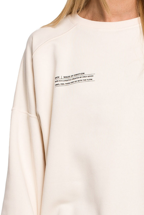 Bluza damska dzianinowa oversize dresowa z nadrukiem waniliowa me613 Bluza damska dzianinowa oversize dresowa z nadrukiem waniliowa me613