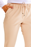 Spodnie damskie dopasowane regulowane gumą i sznurkiem beżowe A600